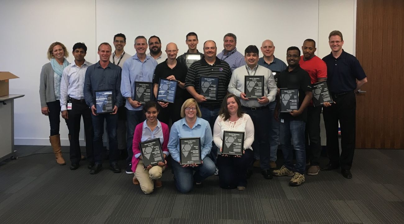 Black Belt graduates with their certificates