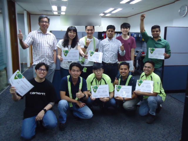 Green Belt graduates celebrating with certificates