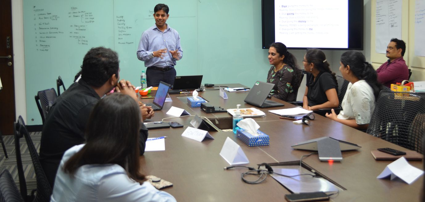 Participants smiling during a voice modulation exercise
